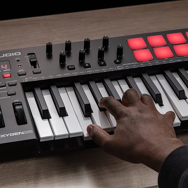 open zoom image for M-Audio Oxygen 25 MKV USB MIDI Controller, 25-Key, New, Action Position Back