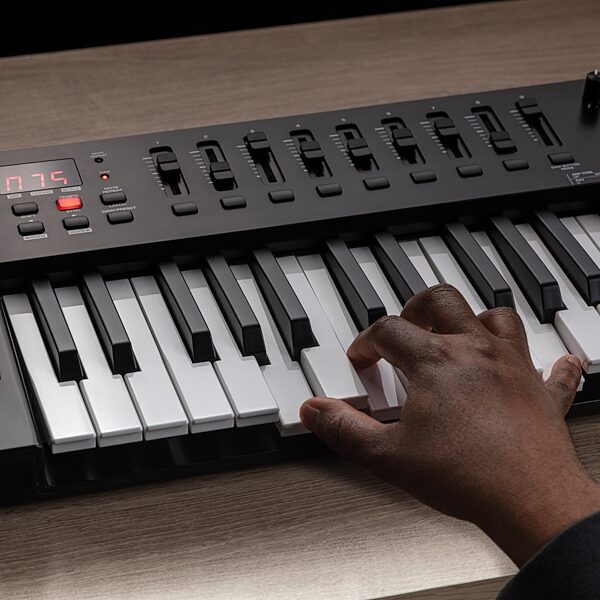 open zoom image for M-Audio Oxygen 61 MKV USB MIDI Controller, 61-Key, New, Action Position Back